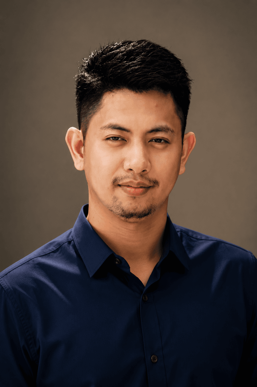 Professional headshot of Eman Garciano